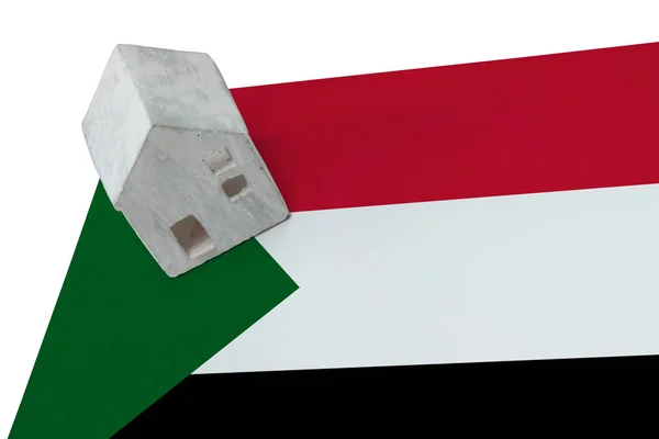 Kleines Haus auf einer Fahne - sudan — Stockfoto