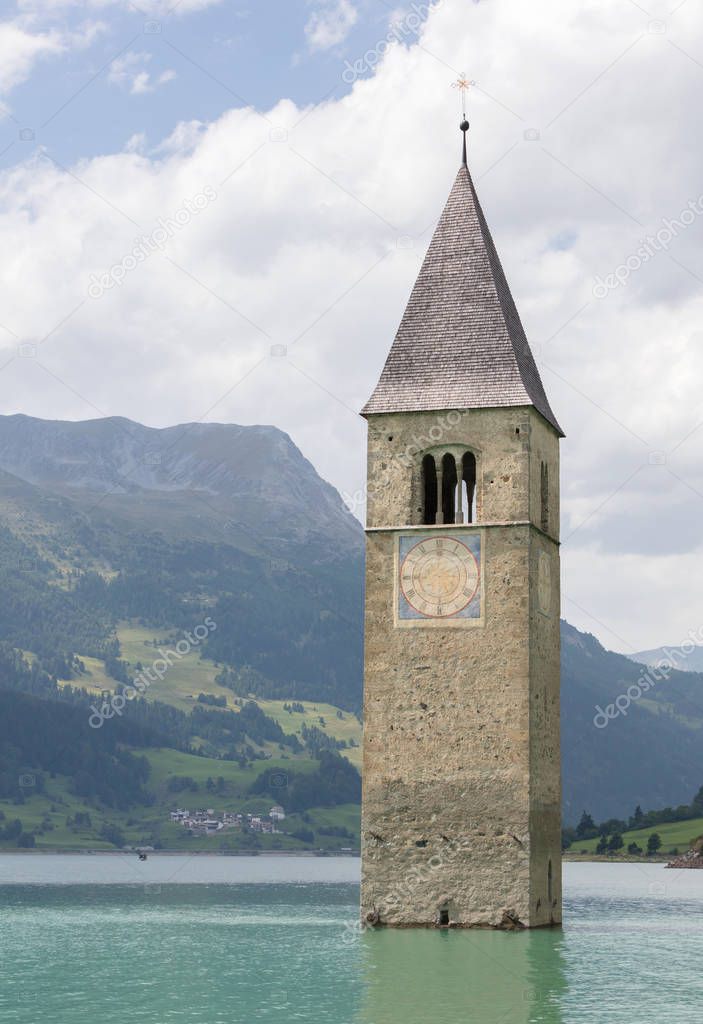 Submerged tower of reschensee church deep in Resias Lake in Tren