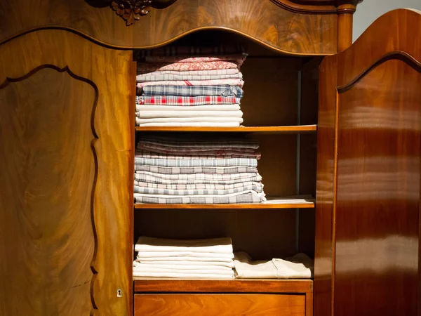 Old clothes in a vintage cupboard — Stock Photo, Image