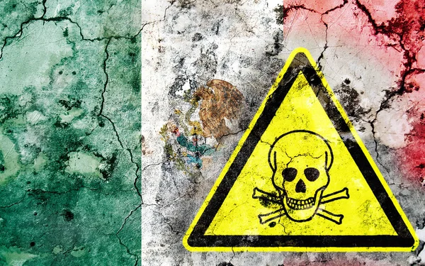 Old cracked wall with poison warning sign and painted flag — Stock Photo, Image