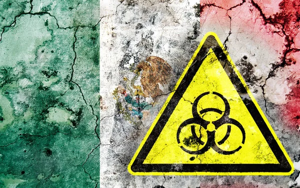 Old cracked wall with biohazard warning sign and painted flag — Stock Photo, Image