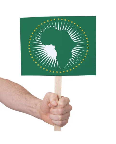 Hand hält kleine Karte - Flagge der Afrikanischen Union — Stockfoto