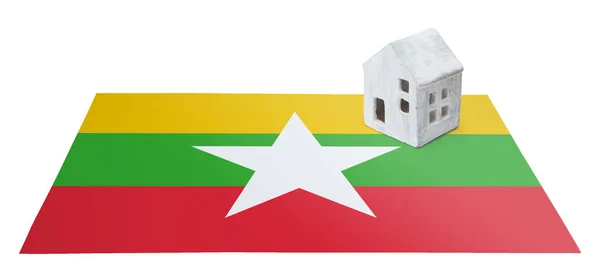 Small house on a flag - Myanmar — Stock Photo, Image