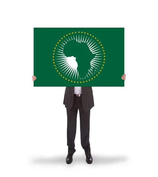 Businessman holding a big card, flag of the African Union — Stock Photo, Image