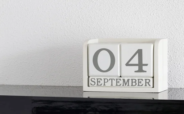 White block calendar present date 4 and month September — Stock Photo, Image