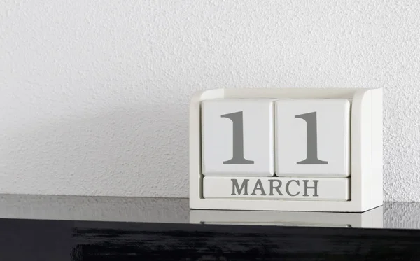 White block calendar present date 11 and month March — Stock Photo, Image