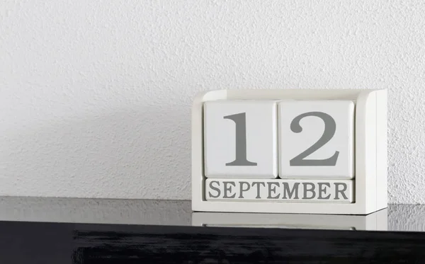 White block calendar present date 12 and month September — Stock Photo, Image