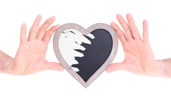 Adult holding heart shaped chalkboard — Stock Photo, Image