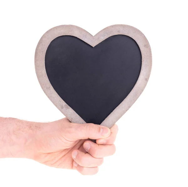 Ενήλικας κρατώντας μαυροπίνακα σε σχήμα καρδιάς — Φωτογραφία Αρχείου