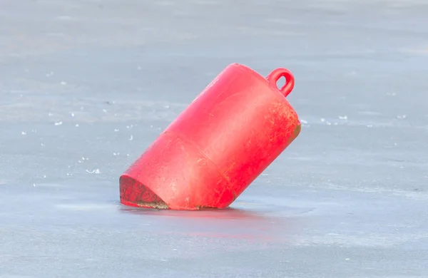 Red buoy in a large pond — Stock Photo, Image