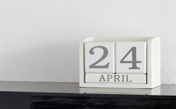 White block calendar present date 24 and month April — Stock Photo, Image