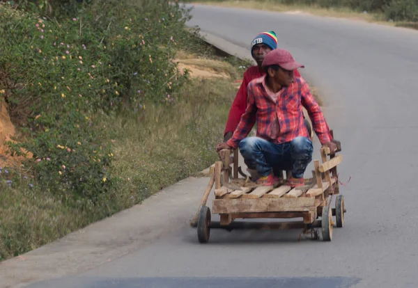 Madagascar on july 29, 2019 - Men sitting an old cart on Madagas — Stock Photo, Image