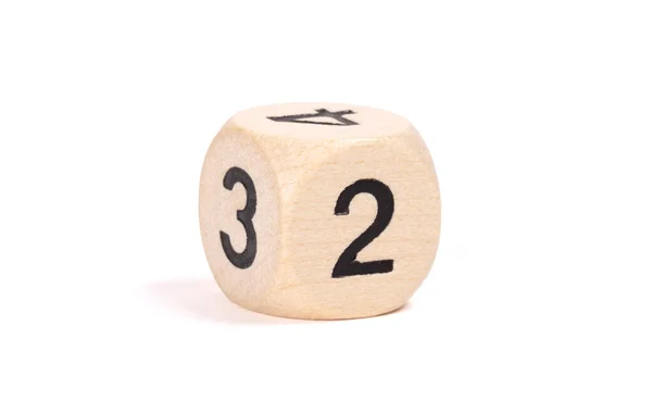Small wooden dice, numbers written on it — Stock Photo, Image