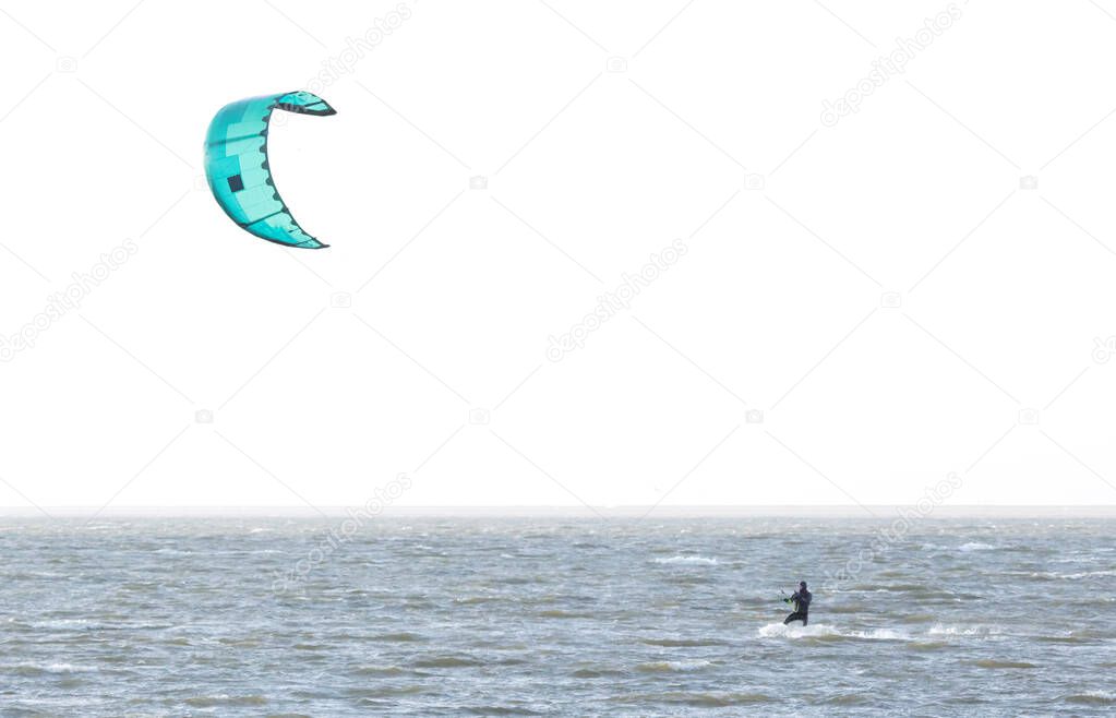 Kitesurfing on the waves of a dutch lake