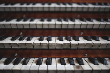 Keys on a big old brown church organ clipart