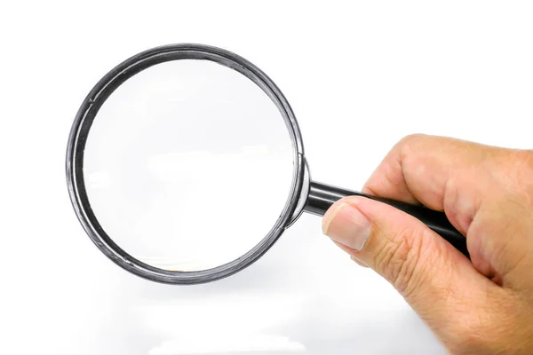 Hand holding a magnifying glass isolate on white background and — Stock Photo, Image