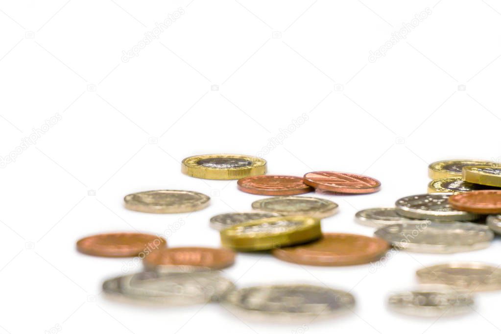 British currency coins laid out scattered and crop on white back