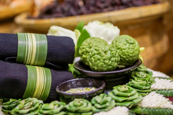 Dark blue woven, Cream scrub and bergamots with decorative pandan on decorative basket.