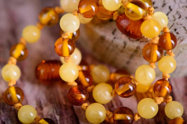 amber beads accessory on stone background