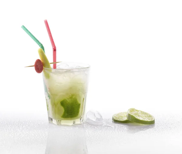 stock image Caipirinha served in a glass with straws and ice cube