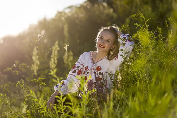 Portrait of a beautiful Ukrainian woman wearing traditional vyshyvanka clothes