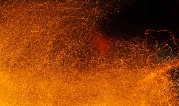 Sparks of fire on a black. Abstract  background with fire sparks