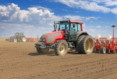 tractors and seeders sowing field clipart