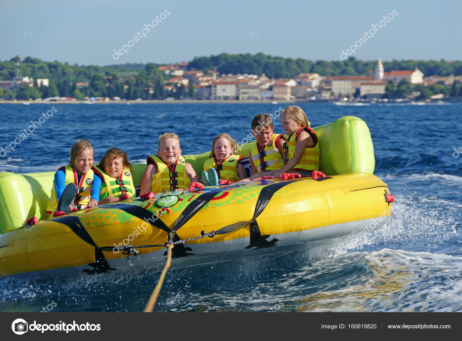Kids having great fun on crazy ufo, water sport — Stock Editorial Photo ©  branex #160619820, image size:1600x1182
