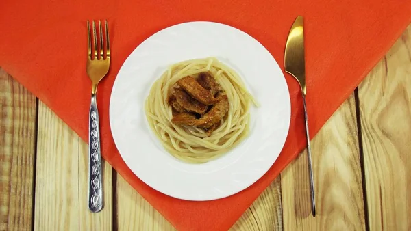 Delicious spaghetti with meat on a white plate.