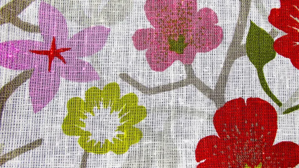 Beautiful background of flowers on light-colored fabric.