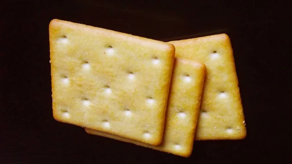 Delicious Salty Crackers Black Background — Stock Photo, Image