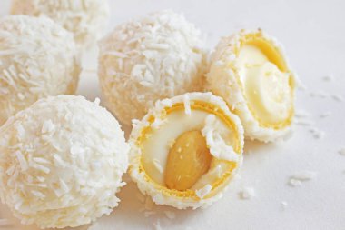 Coconut candy with nuts isolated on a white background.