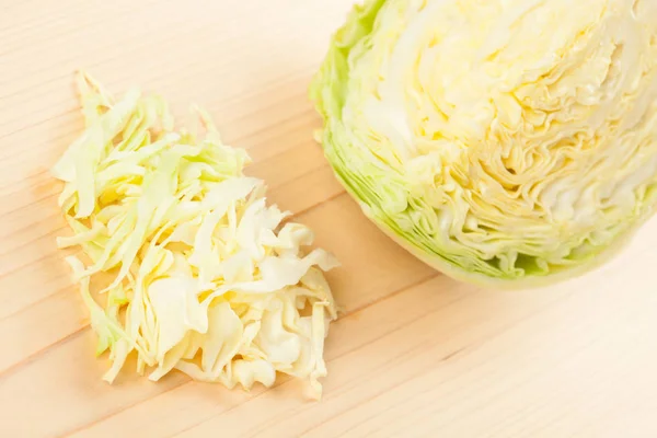 Sliced cabbage on wood — Stock Photo, Image