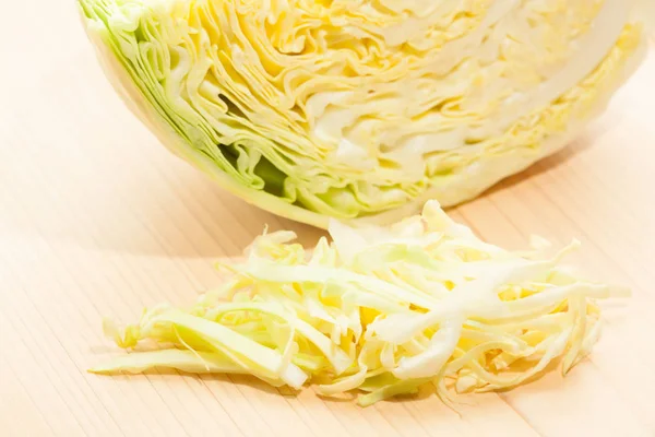 Sliced cabbage on wood — Stock Photo, Image