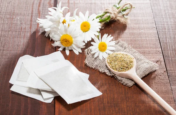 Composition of teabags and flowers — Stock Photo, Image