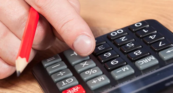 Businessman counting with calculator — Stock Photo, Image
