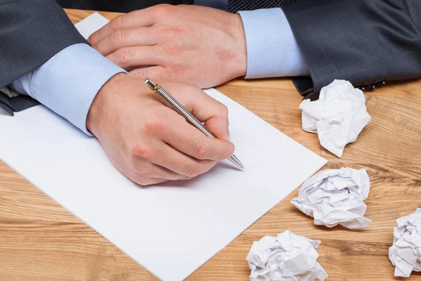 Businessman writing at workplace — Stock Photo, Image