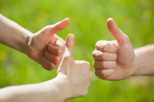 Hands showing thumb up signs — Stock Photo, Image