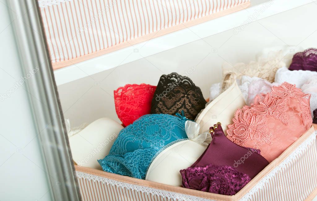 lacy underwear stored in cases of wardrobe