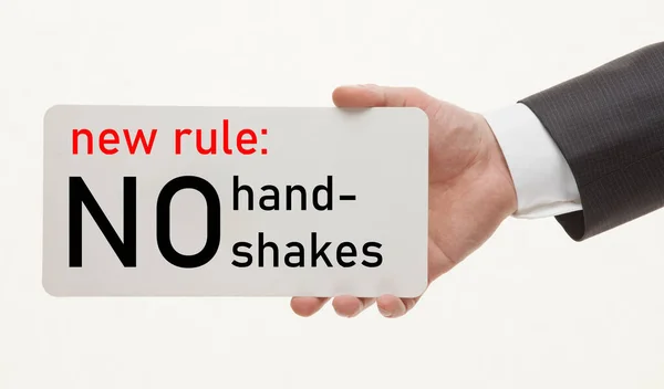 Mans hand demonstrates a reminder to avoid handshakes — Stock Photo, Image