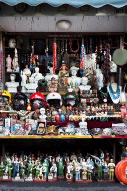 An antique-packed stall at Shanghai's Dongtai Road antique market clipart