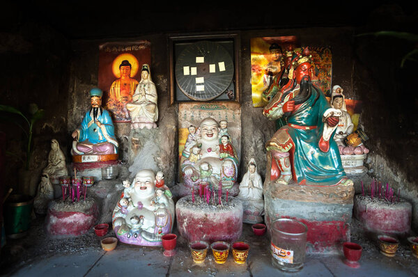 Collection of Chinese gods in an outdoor shrine, Hong Kong