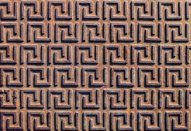 Bir eski paslı demir yüzeyinde düzgün bir desen.