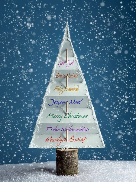 Christmas tree with seasonal greetings — Stock Photo, Image