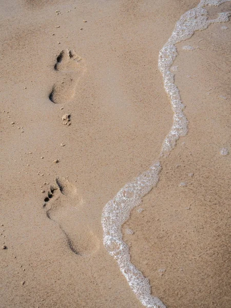 Voetafdrukken op het zand Stockfoto