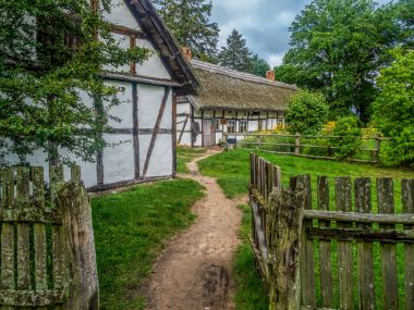 Old wooden farmstead in Kluki, Poland clipart