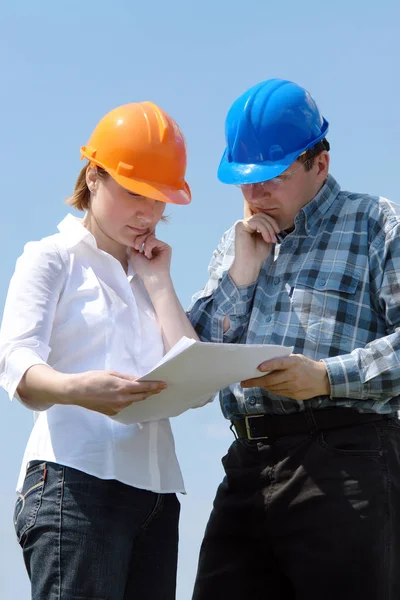 Studying building plans — Stock Photo, Image