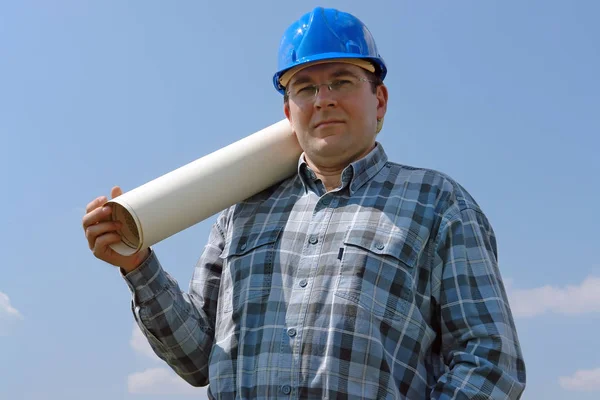 Construction site manager with building plans — Stock Photo, Image