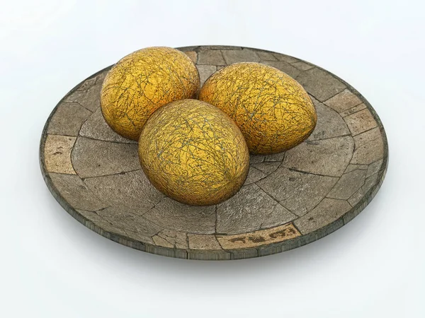 Tre gyllene ägg på sten tallrik — Stockfoto