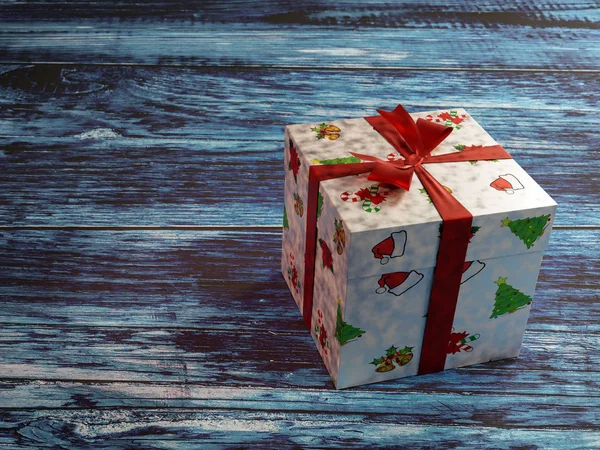 Christmas Present Box Red Ribbon Rustic Bluish Wooden Plank Surface — Stock Photo, Image